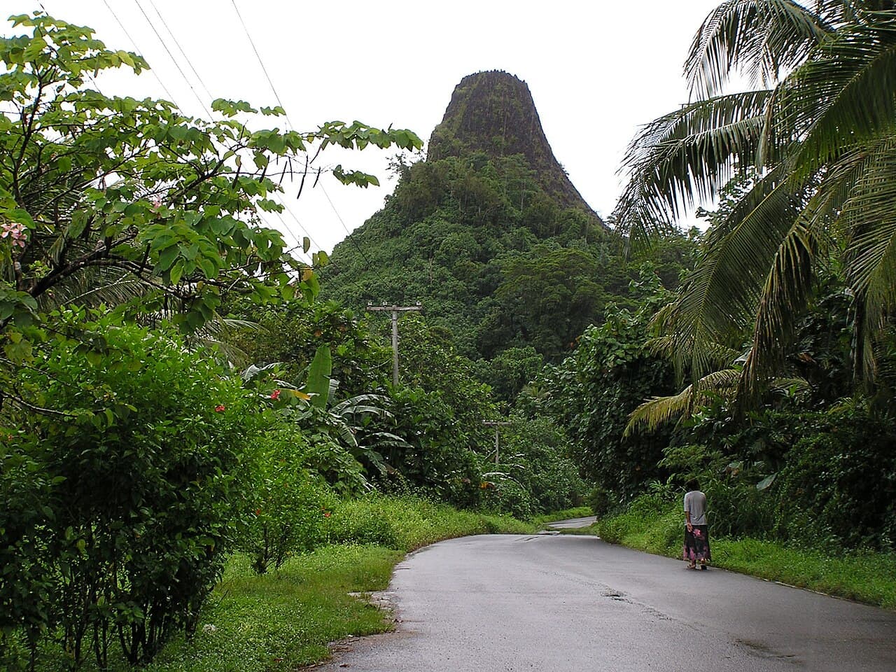 A waterfall tumbling through thick green rainforest on Pohnpei island