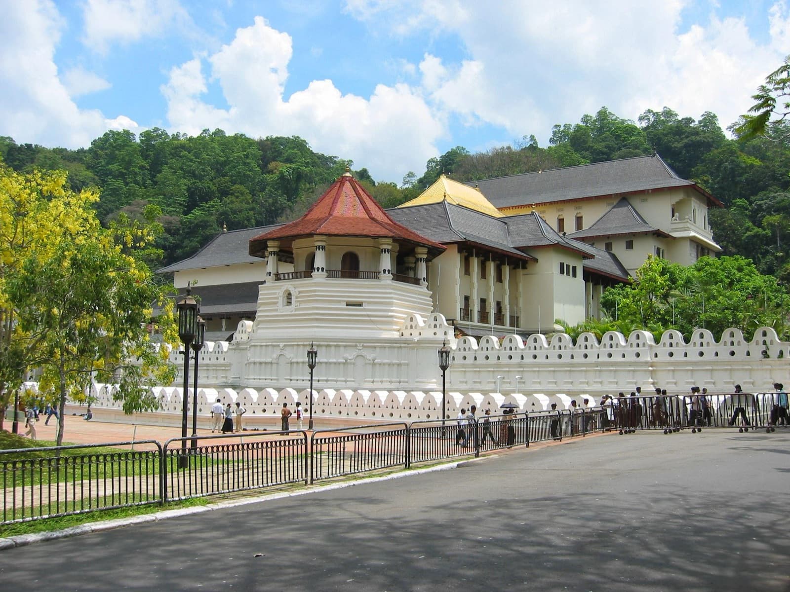 The white walls and golden roof of the Temple of the Tooth in Kandy
