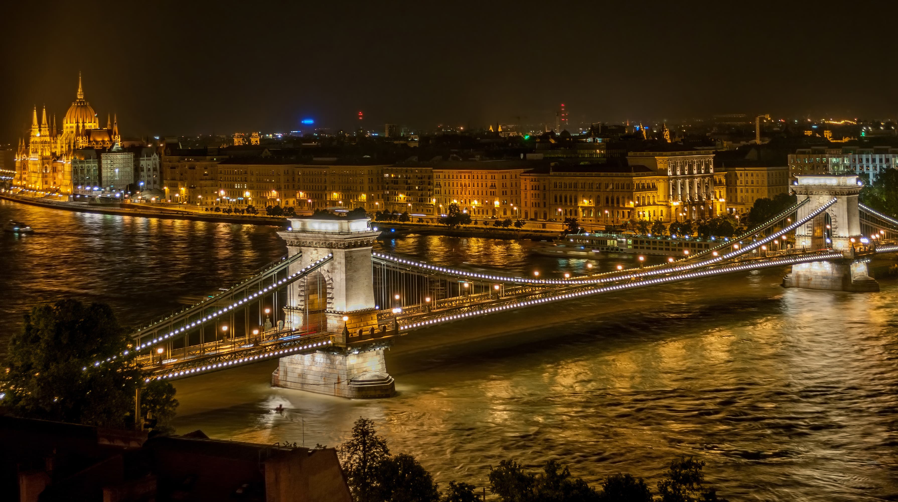 Budapest's Chain Bridge lit up at night with Parliament in the background