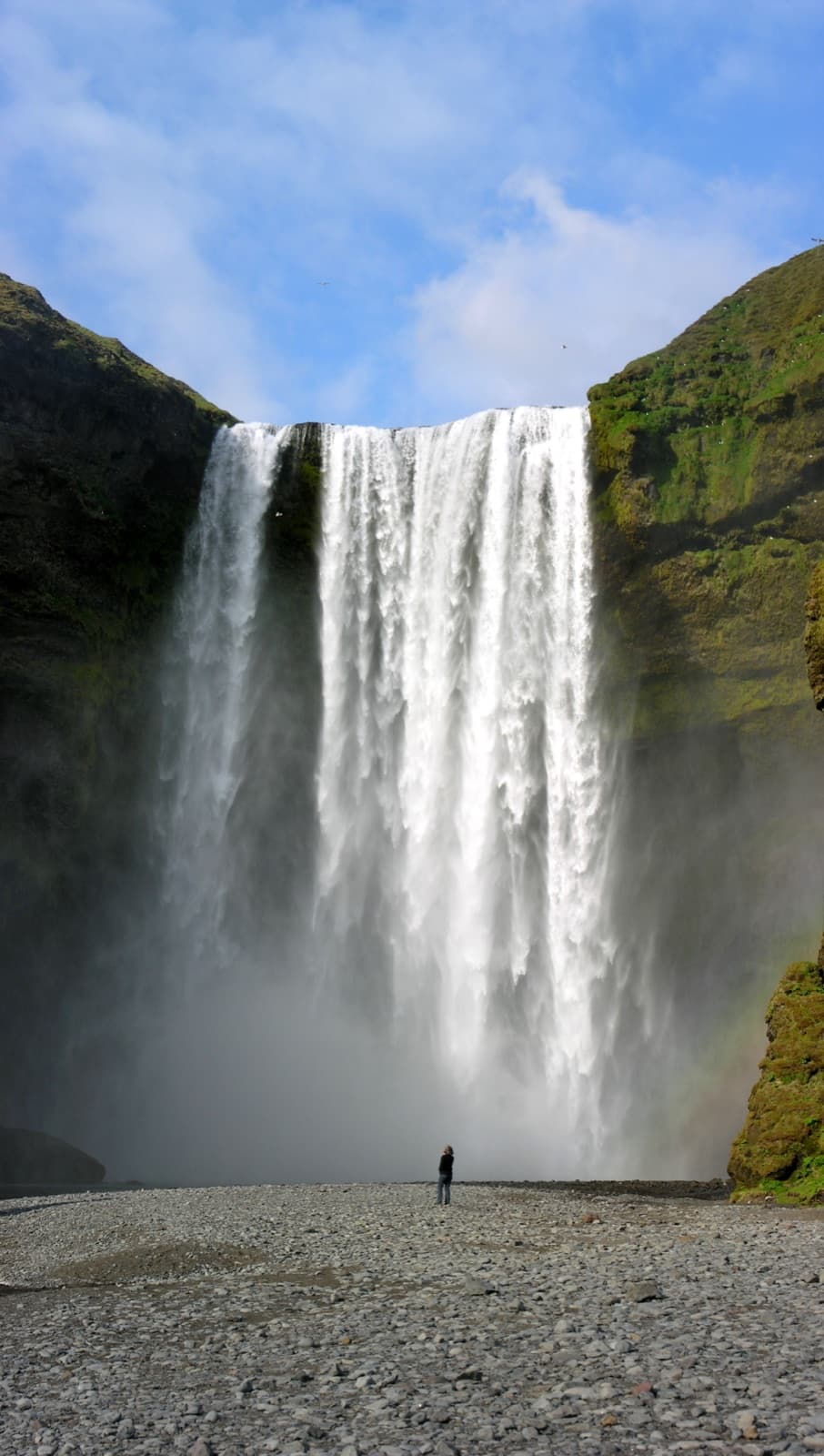 Sk贸gafoss waterfall thundering down a vertical cliff in southern Iceland